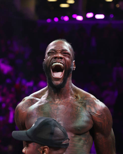 Deontay Wilder celebrates after knocking out Robert Helenius in the first round during their WBC world heavyweight title eliminator bout at Barclays Center on October 15, 2022 in Brooklyn, New York. 