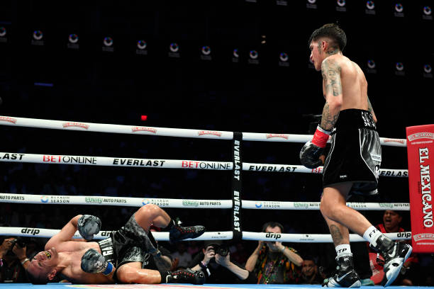PHOENIX, ARIZONA - JUNE 29: Jesse ‘Bam’ Rodriguez of the United States knocks out Juan Francisco Estrada of Mexico in the seventh round of their WBC world and Ring Magazine super flyweight title bout at Footprint Center on June 29, 2024, in Phoenix, Arizona. (Photo by Kelsey Grant/Getty Images)
